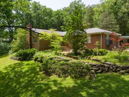 a view of a backyard with jacuzzi