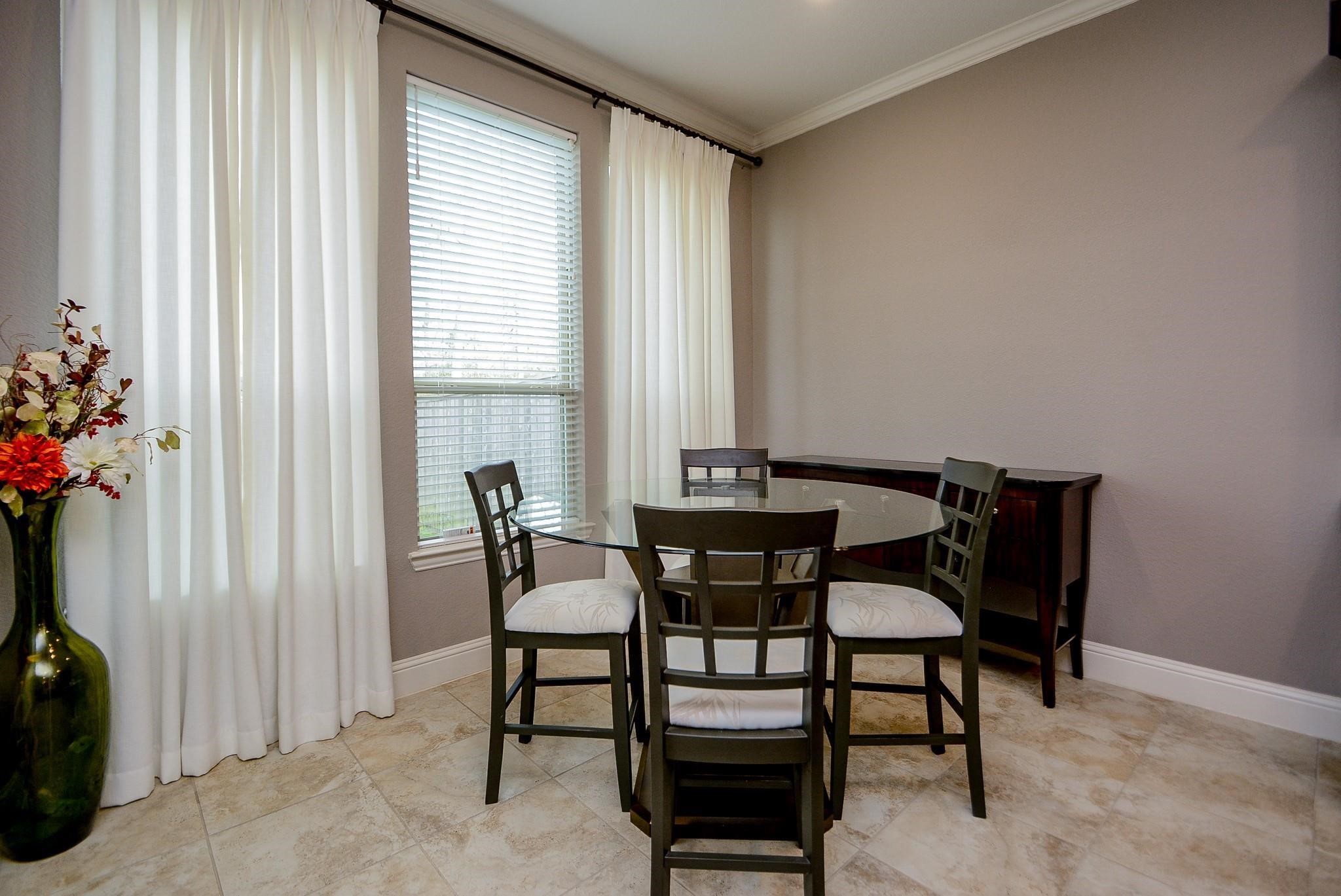 114 Silver Sky Street Conroe, TX 77304 - Photo 15 of 36 a dining room with furniture and window