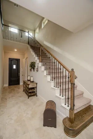 a view of staircase with furniture and stairs