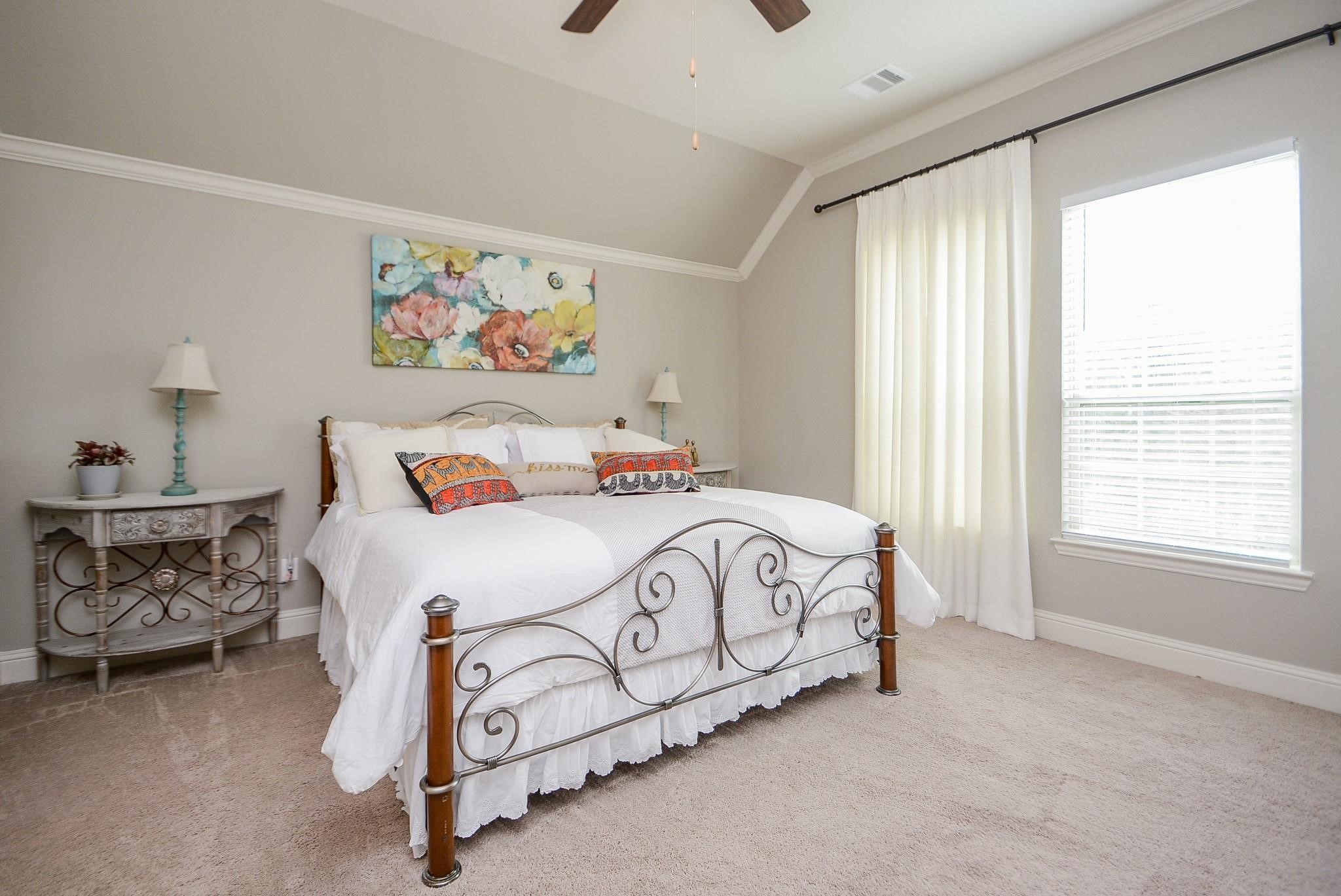 114 Silver Sky Street Conroe, TX 77304 - Photo 20 of 36 a bedroom with a bed and window
