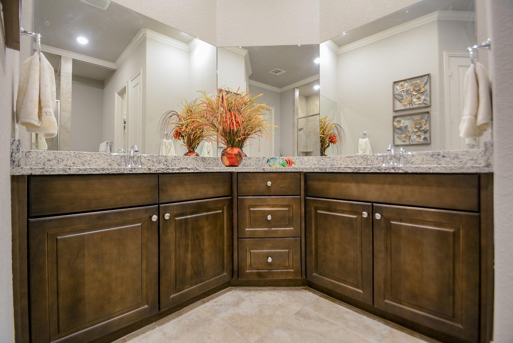 114 Silver Sky Street Conroe, TX 77304 - Photo 22 of 36 a bathroom with a sink and a mirror