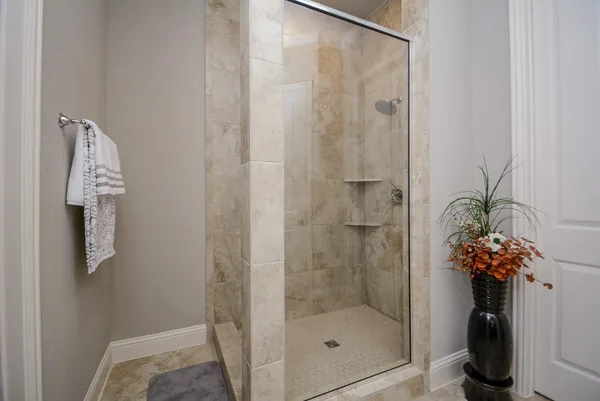 a bathroom with a shower and a sink
