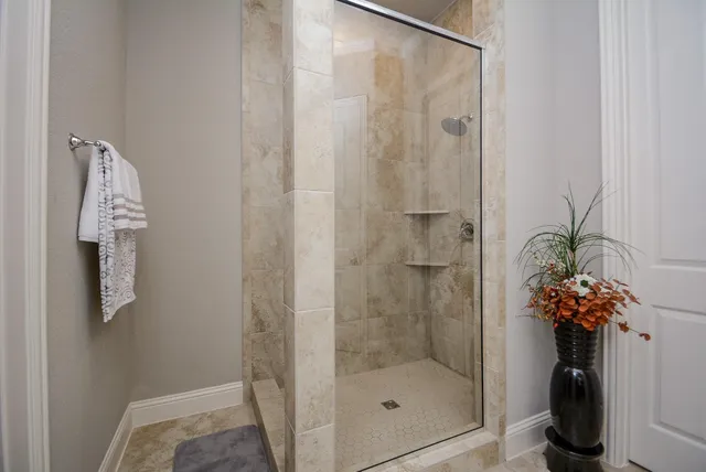 a bathroom with a shower and a sink
