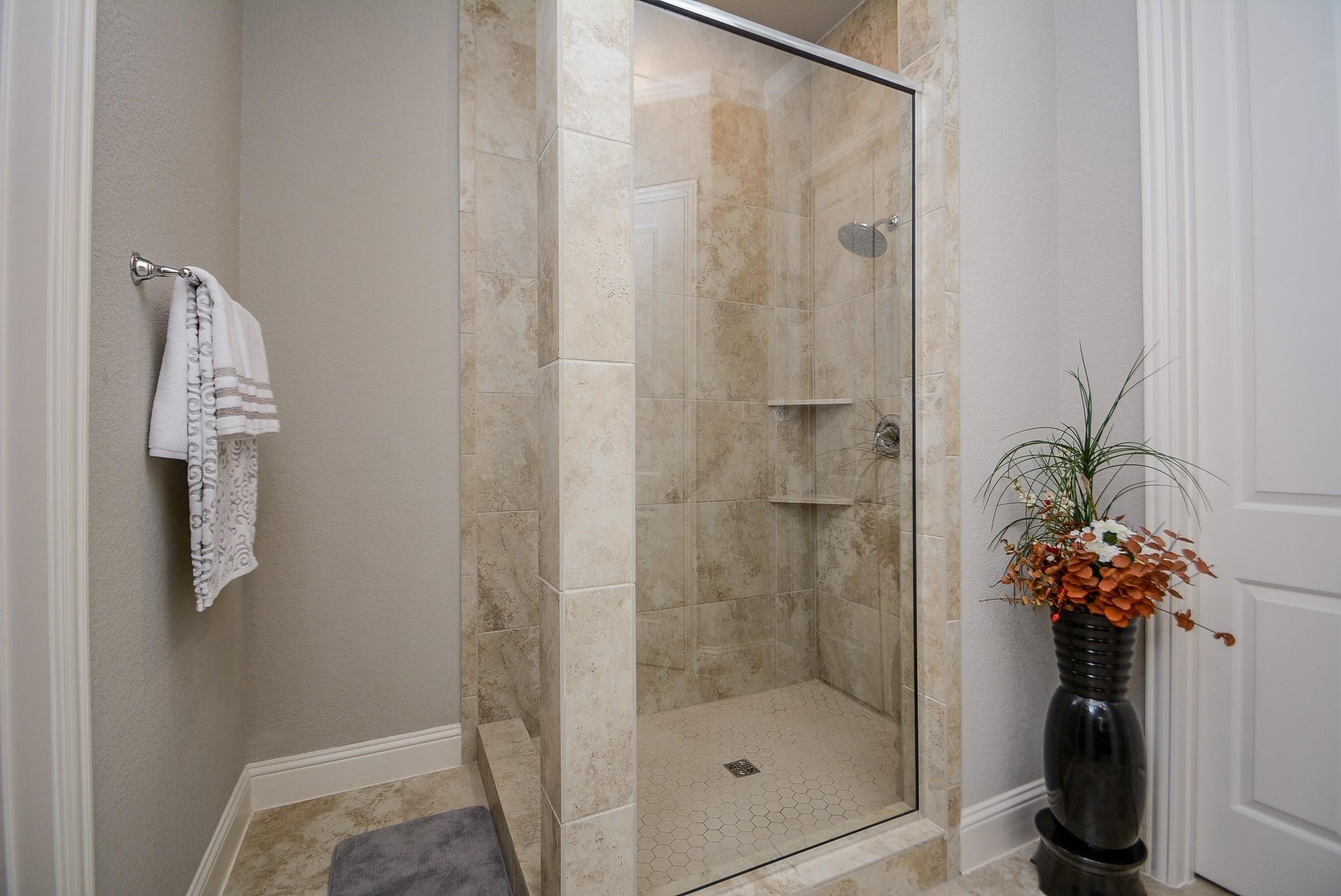 114 Silver Sky Street Conroe, TX 77304 - Photo 23 of 36 a bathroom with a shower and a sink