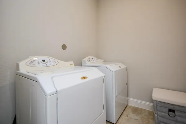 a view of house with backyard front of house