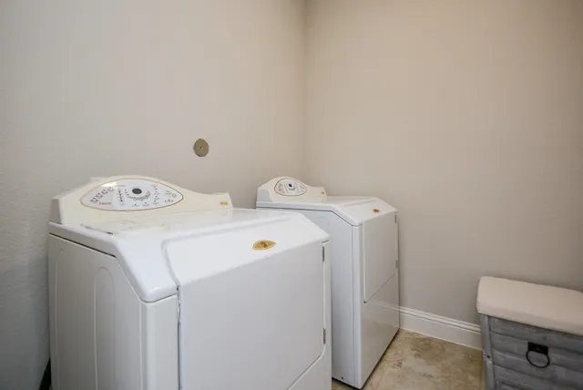 a view of house with backyard front of house