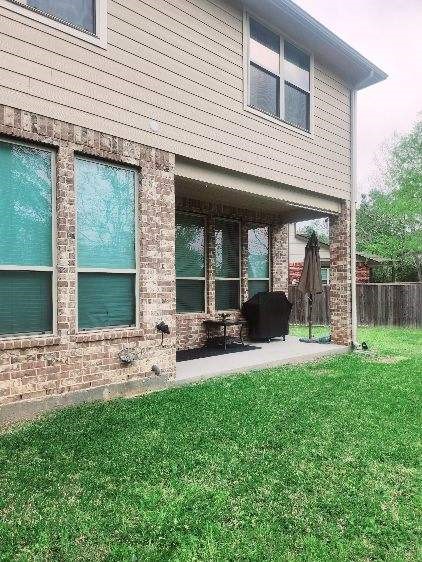 114 Silver Sky Street Conroe, TX 77304 - Photo 33 of 36 a view of a house with backyard and porch