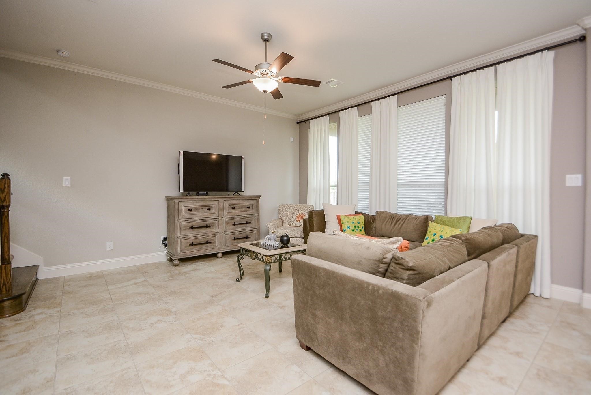 114 Silver Sky Street Conroe, TX 77304 - Photo 6 of 36 a living room with furniture and a flat screen tv