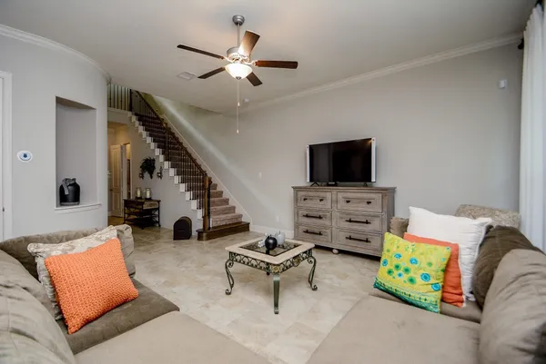 a living room with furniture and a flat screen tv