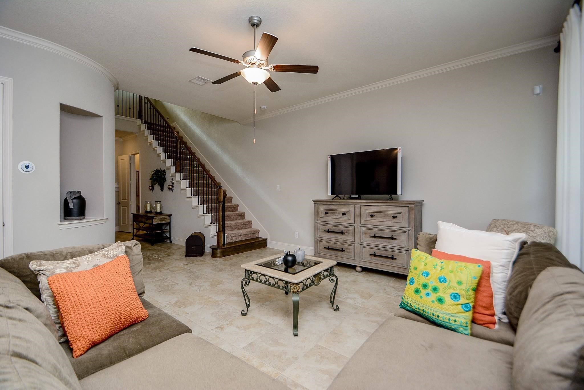 114 Silver Sky Street Conroe, TX 77304 - Photo 7 of 36 a living room with furniture and a flat screen tv