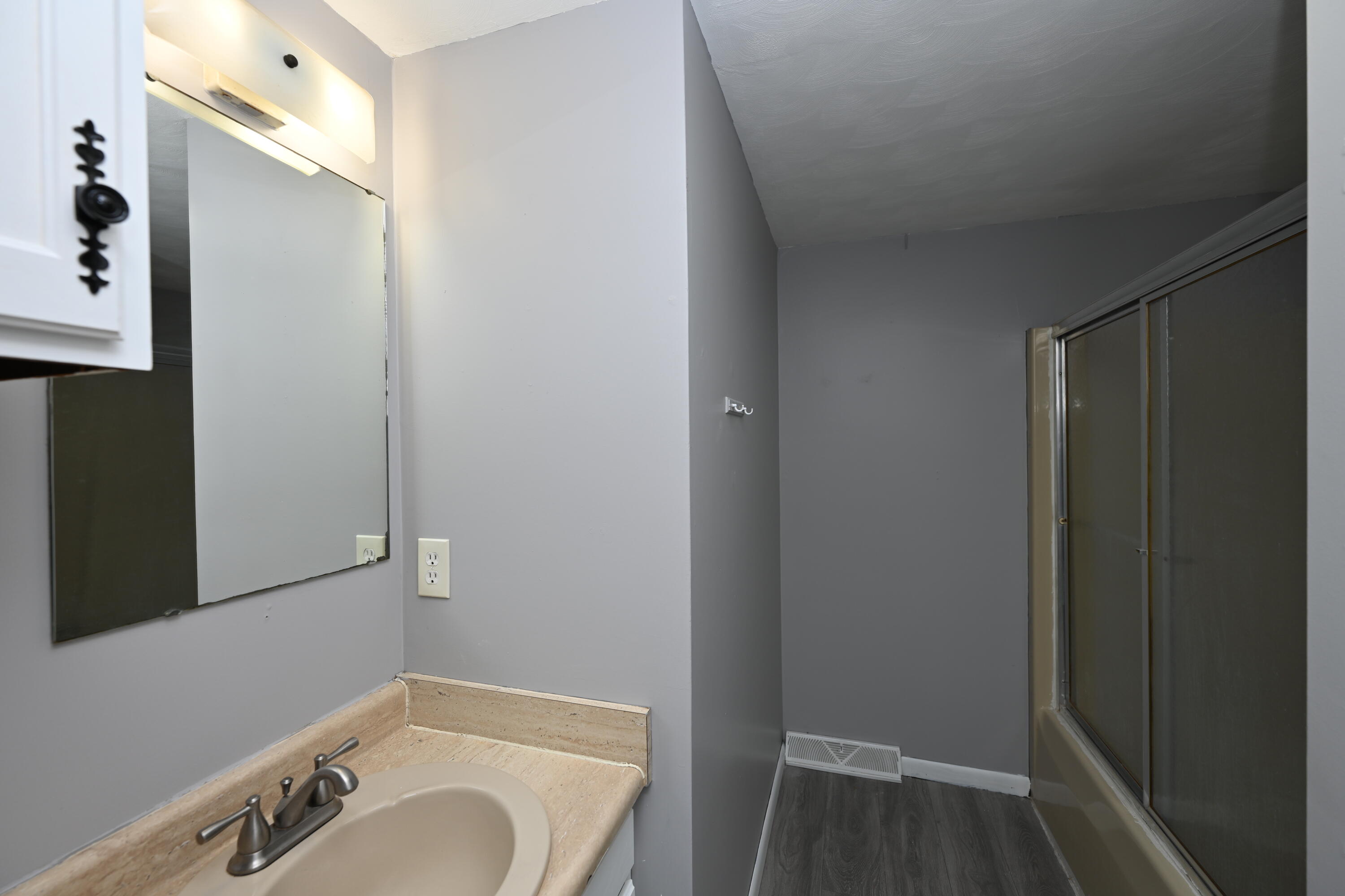 411 West Jefferson Street Winamac, IN 46996 - Photo 17 of 23 a bathroom with a sink and a mirror