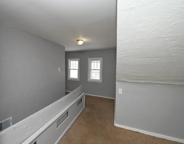 a view of an empty room and window