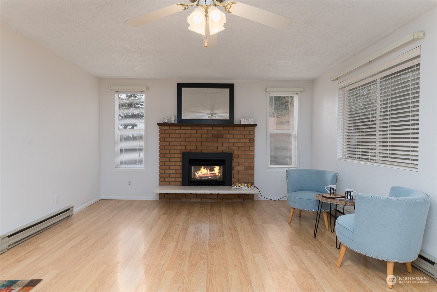 730 East Del Ray Road Lynden, WA 98264 - Photo 16 of 40 a living room with furniture and a fireplace