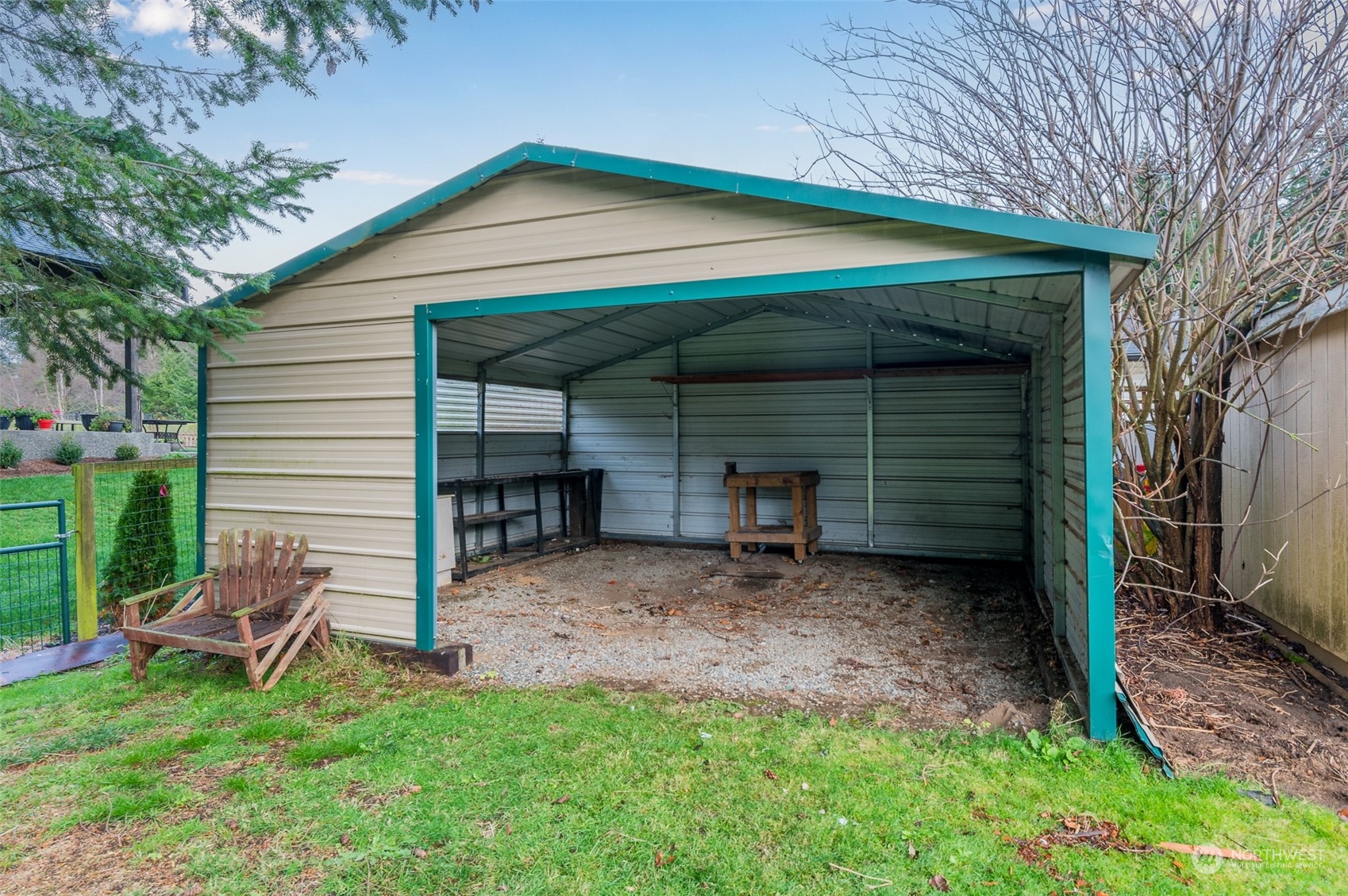 730 East Del Ray Road Lynden, WA 98264 - Photo 29 of 40 a backyard of a house with table and chairs