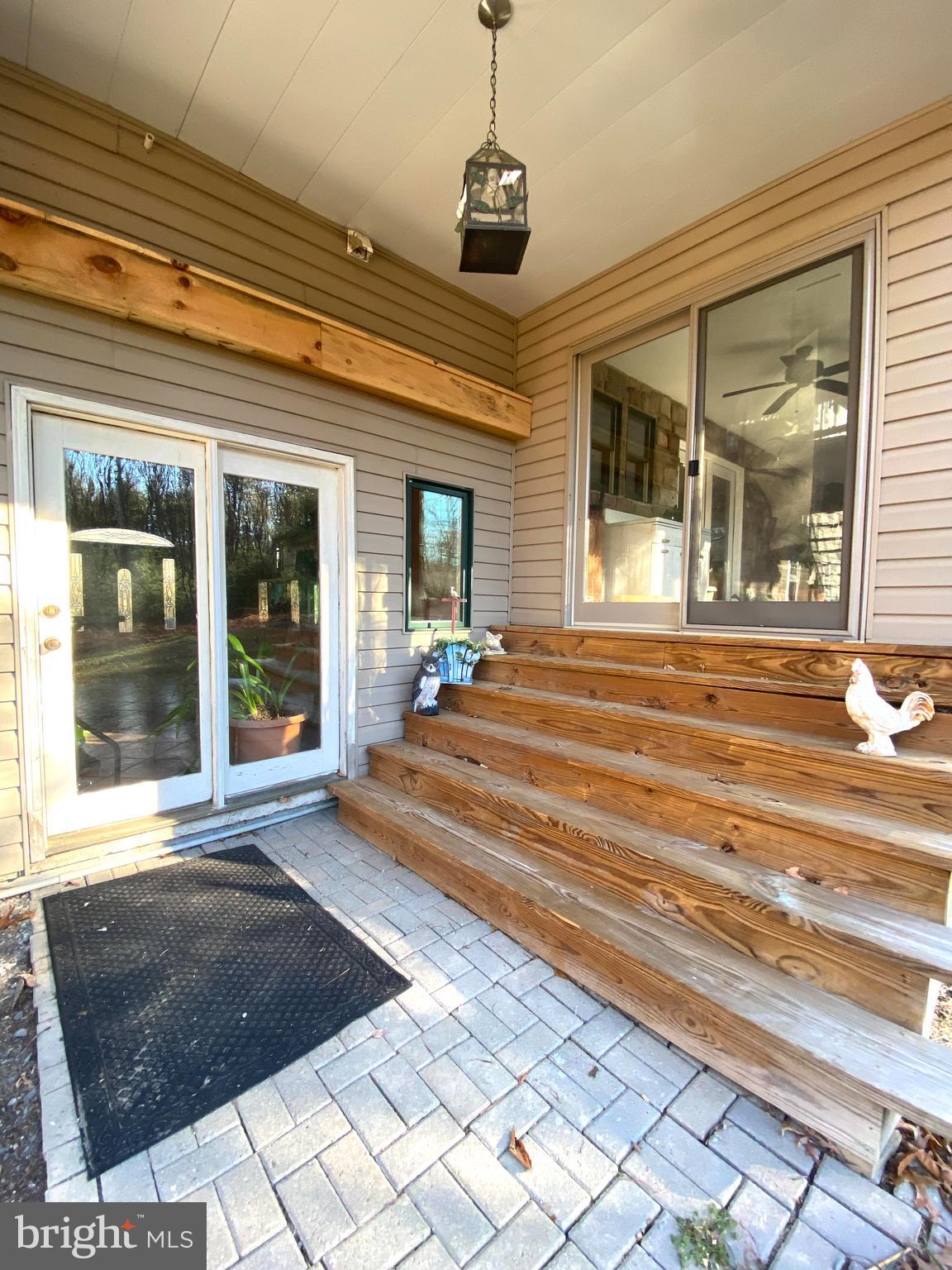 590 Indiana Road Landisburg, PA 17040 - Photo 21 of 128 Rear patio, access to sunroom and Dining/kitchen