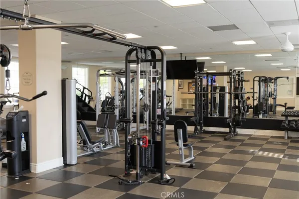 a room with pool table and windows