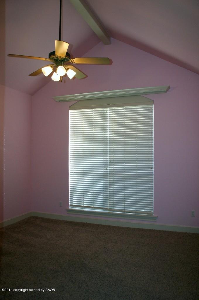 5827 Nicholas Circle Amarillo, TX 79109 - Photo 16 of 23 a view of a livingroom with a fan a ceiling fan and a window