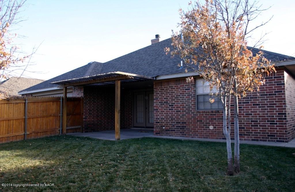 5827 Nicholas Circle Amarillo, TX 79109 - Photo 21 of 23 a view of a house with a backyard