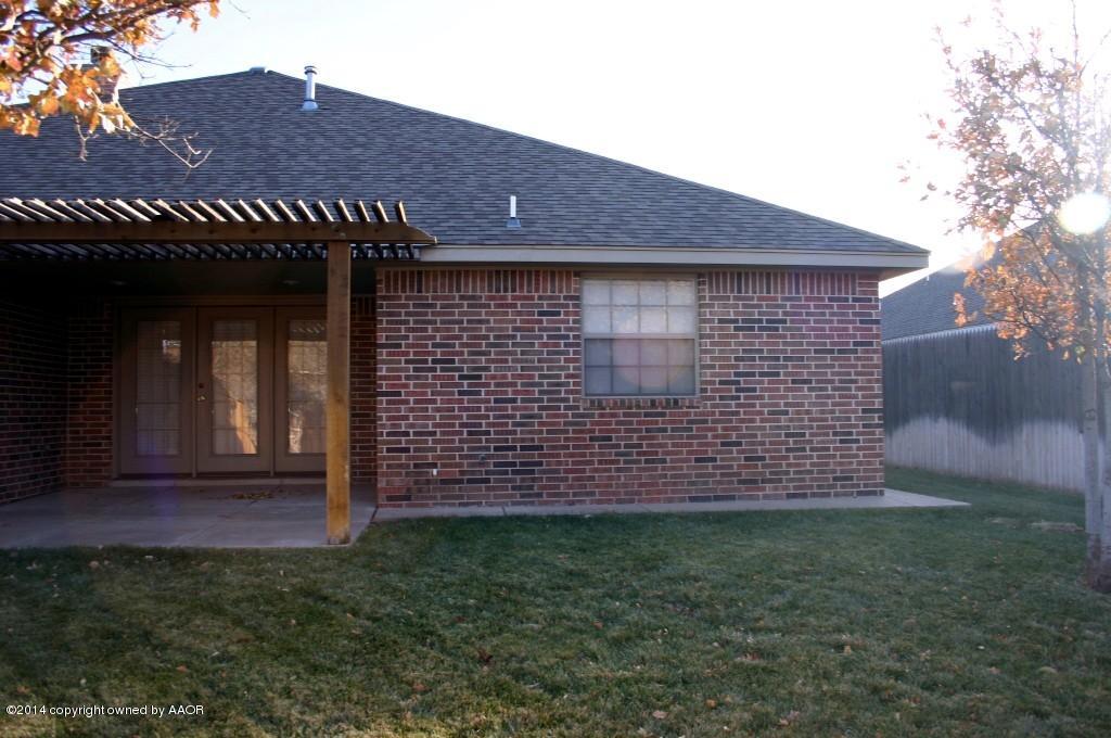 5827 Nicholas Circle Amarillo, TX 79109 - Photo 22 of 23 a view of a house with a yard