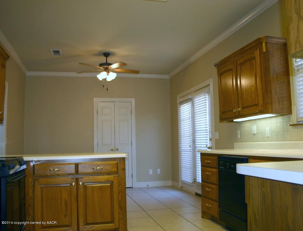 5827 Nicholas Circle Amarillo, TX 79109 - Photo 5 of 23 a bathroom with a sink vanity and a mirror