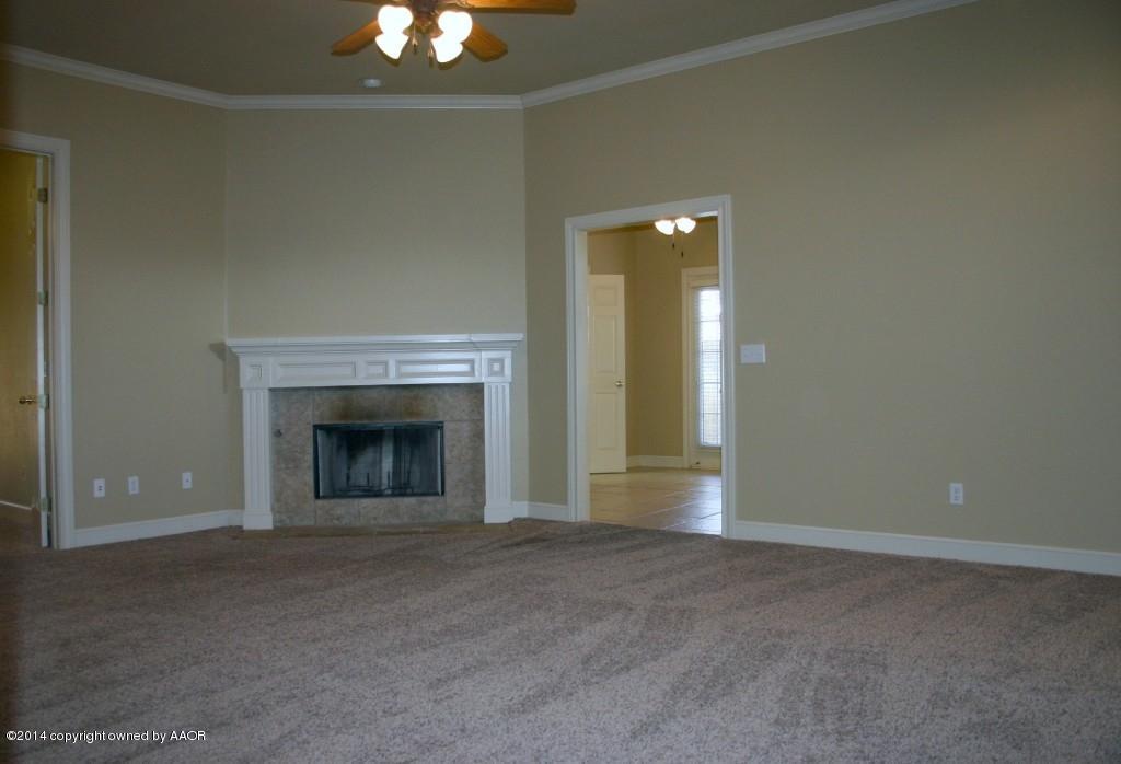 5827 Nicholas Circle Amarillo, TX 79109 - Photo 9 of 23 a view of an empty room with a fireplace