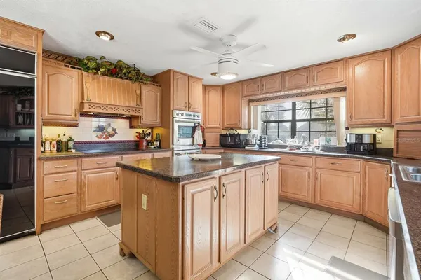 a kitchen with a sink and a window