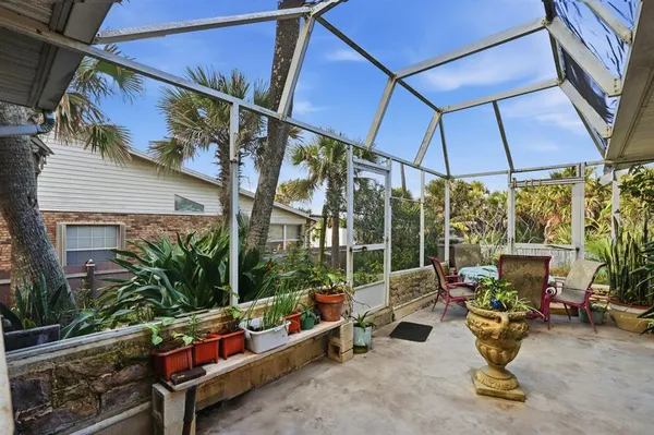a outdoor living space with furniture and a potted plant
