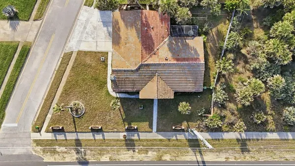 an aerial view of a house with a ocean view