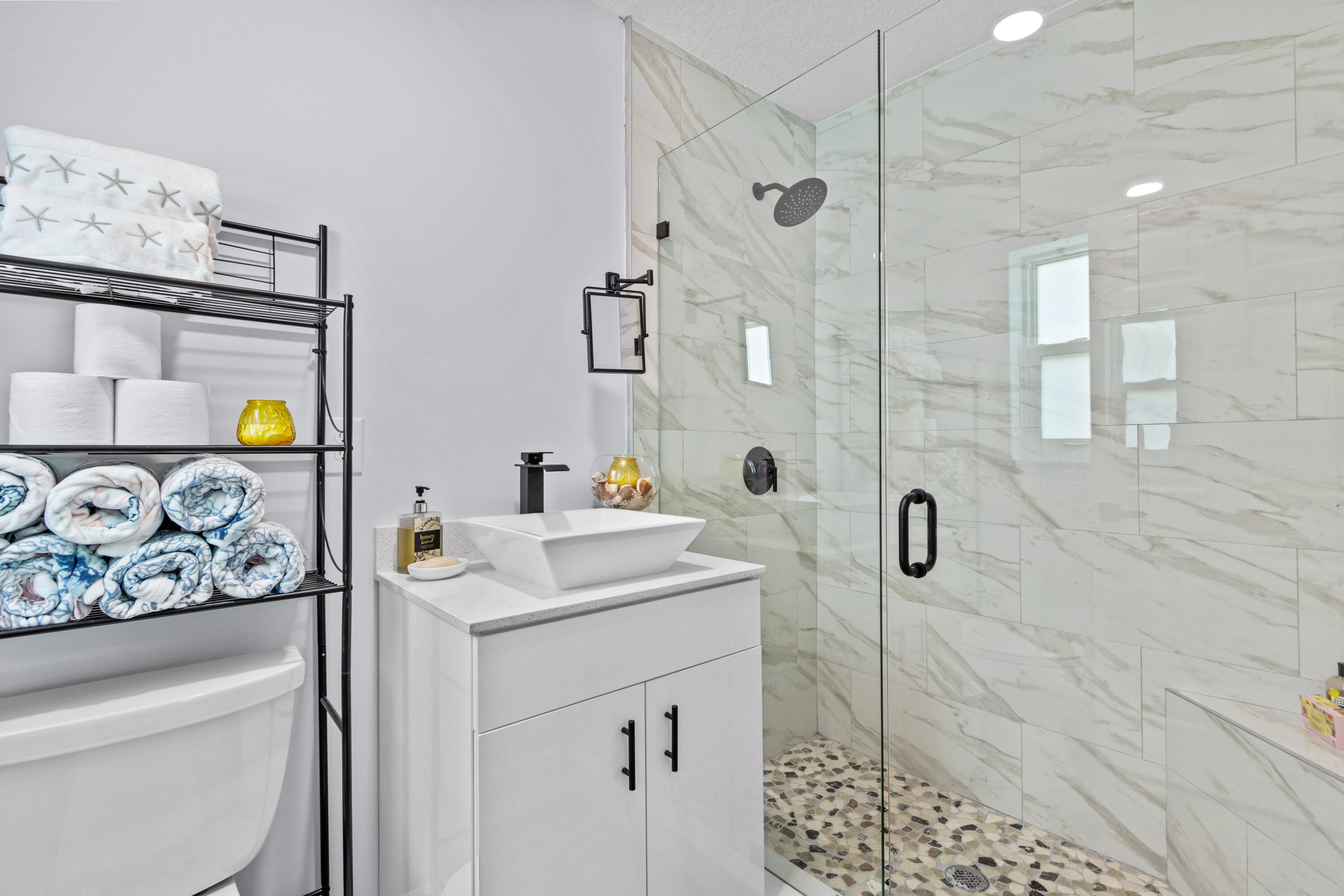 711 South Ocean Drive, Unit B Fort Pierce, FL 34949 - Photo 12 of 21 a bathroom with a sink toilet and shower