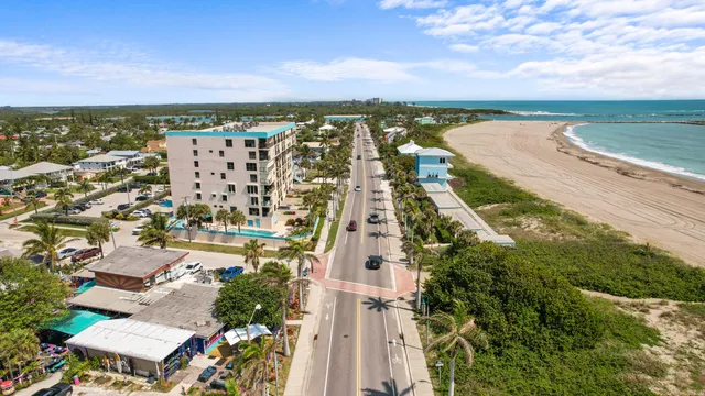 an aerial view of residential building and lake