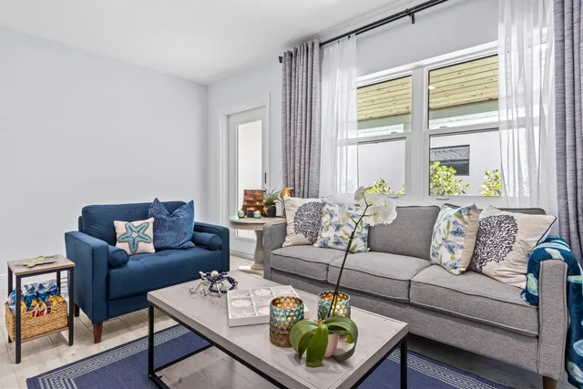 a living room with furniture and a large window