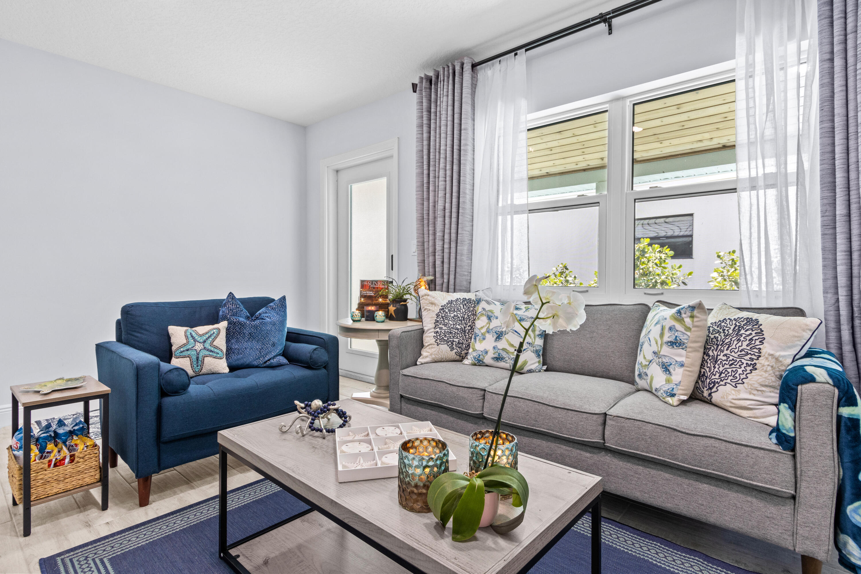 711 South Ocean Drive, Unit B Fort Pierce, FL 34949 - Photo 5 of 21 a living room with furniture and a large window