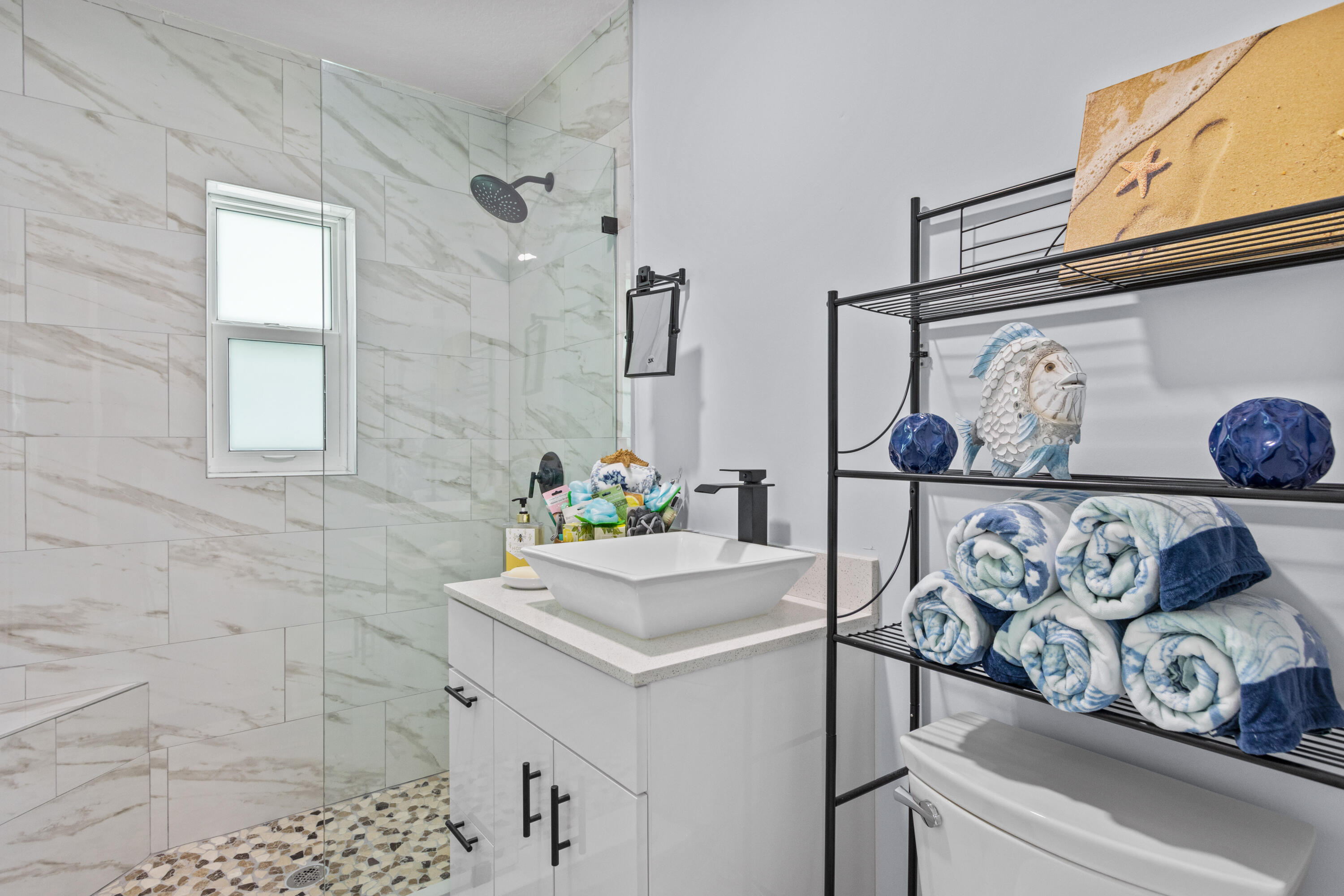 711 South Ocean Drive, Unit B Fort Pierce, FL 34949 - Photo 10 of 21 a bathroom with a sink and a mirror