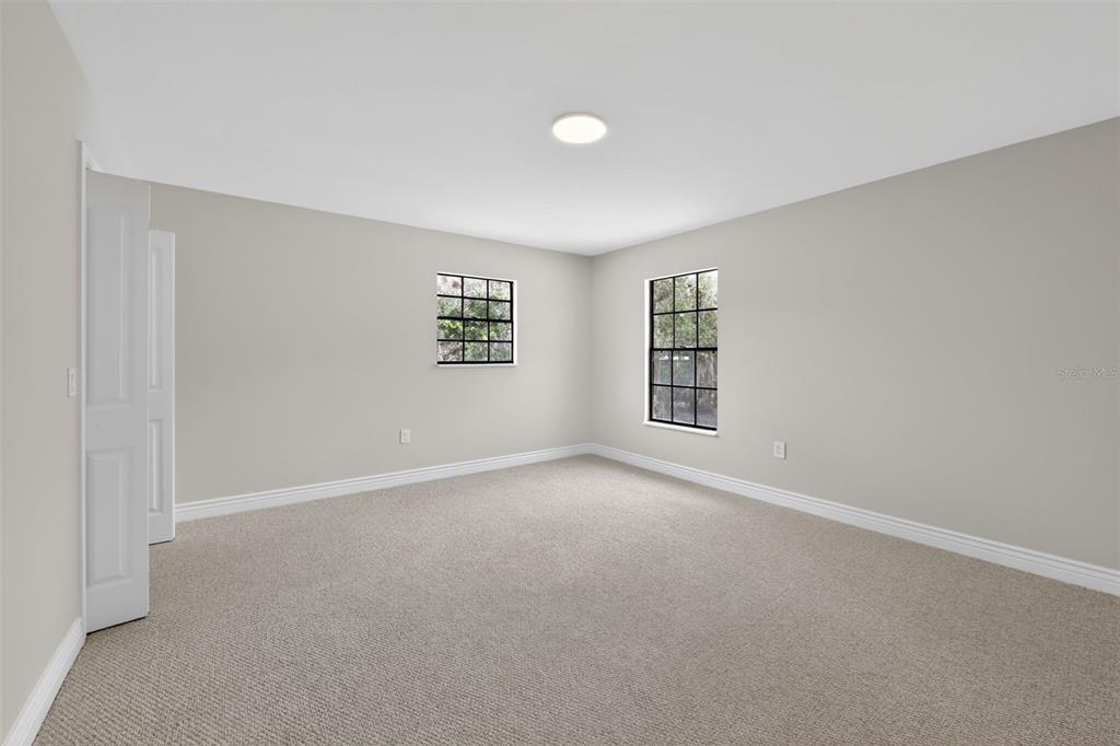 4570 Hidden River Road Sarasota, FL 34240 - Photo 23 of 45 a view of an empty room with a window