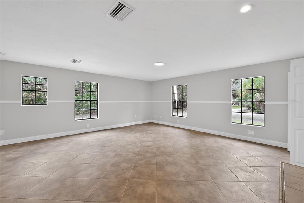 4570 Hidden River Road Sarasota, FL 34240 - Photo 28 of 45 an empty room with windows