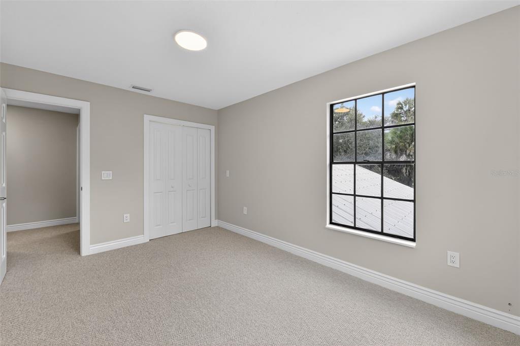 4570 Hidden River Road Sarasota, FL 34240 - Photo 34 of 45 an empty room with windows and closet