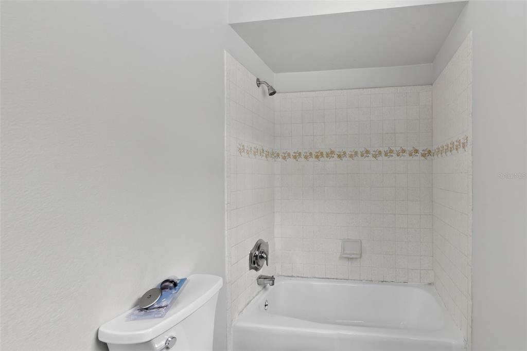 4570 Hidden River Road Sarasota, FL 34240 - Photo 39 of 45 a bathroom with a bathtub