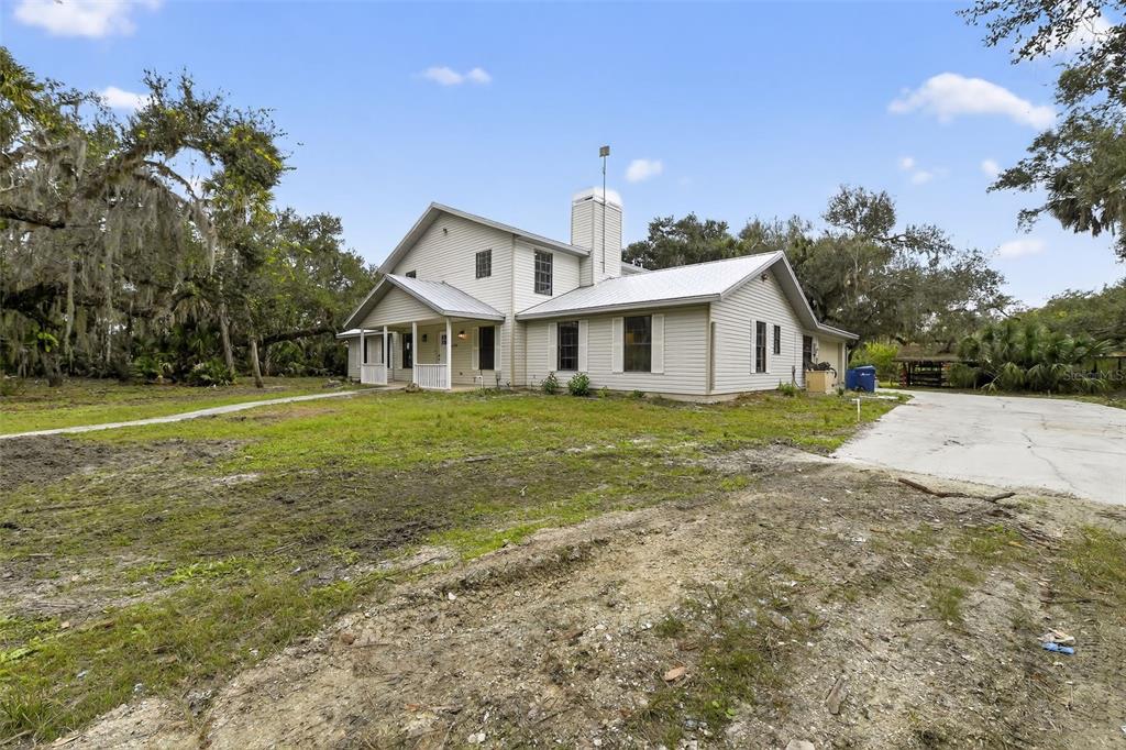 4570 Hidden River Road Sarasota, FL 34240 - Photo 5 of 45 a view of a house with a yard