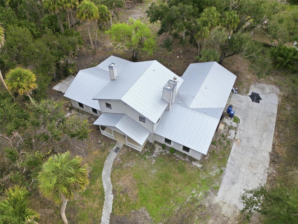 4570 Hidden River Road Sarasota, FL 34240 - Photo 6 of 45 an aerial view of a house with pool garden and yard