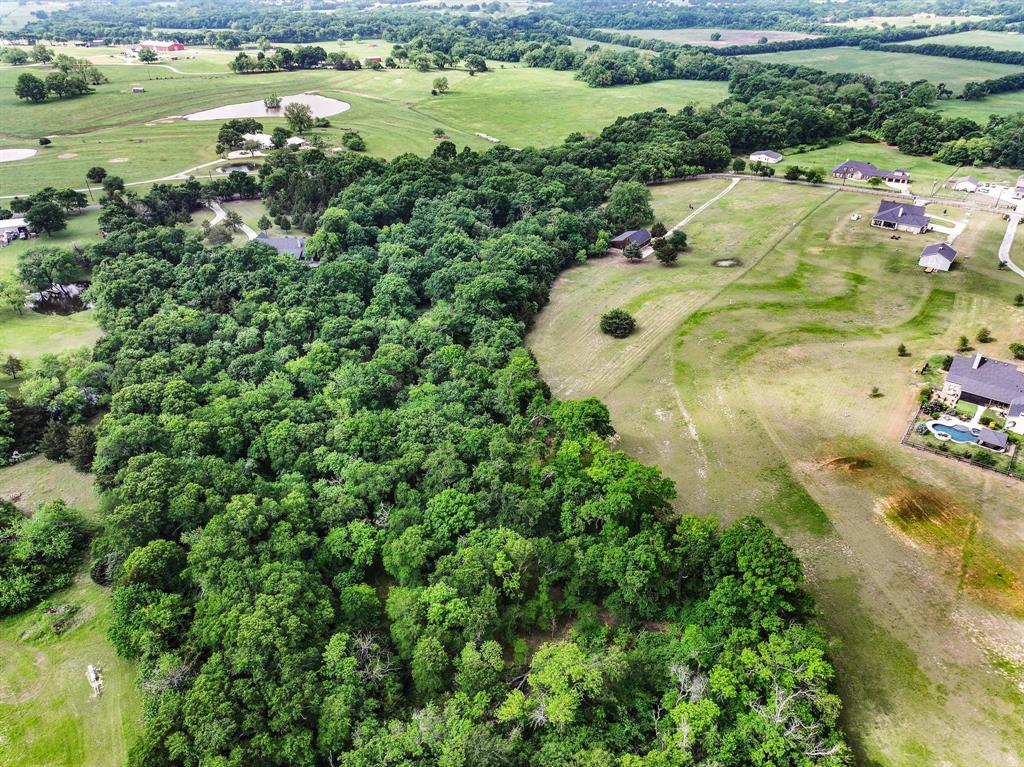1906 Durning Road Van Alstyne, TX 75495 - Photo 14 of 40 an aerial view of a residential houses with outdoor space and trees all around