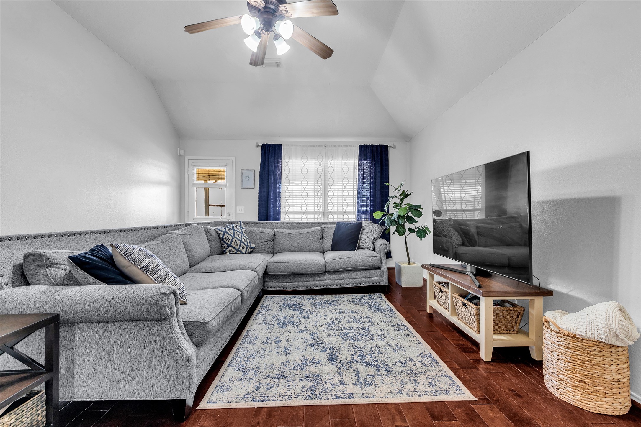 30303 Castle Forest Drive Spring, TX 77386 - Photo 14 of 41 a living room with furniture and a flat screen tv