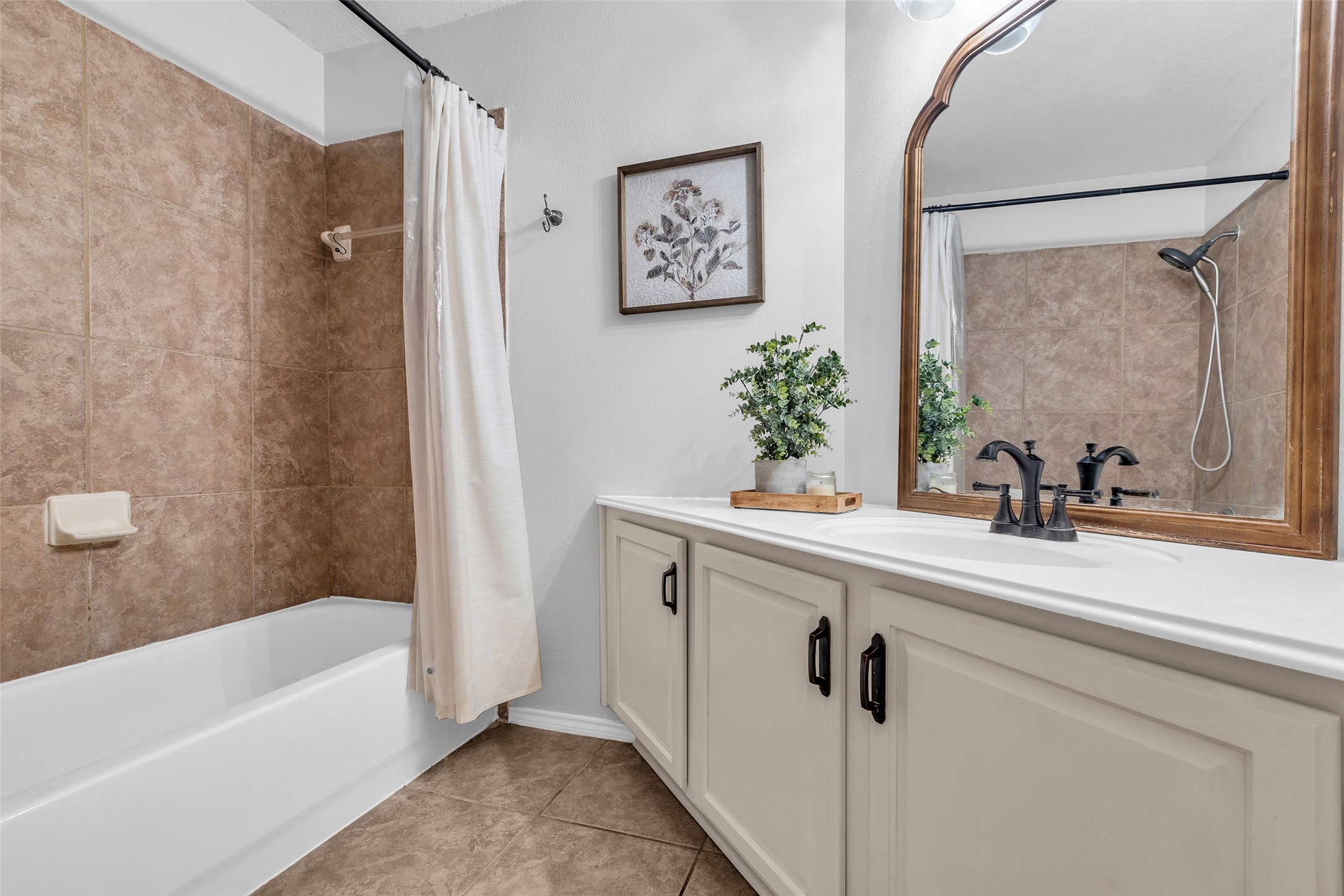 30303 Castle Forest Drive Spring, TX 77386 - Photo 20 of 41 a bathroom with a sink and a bathtub