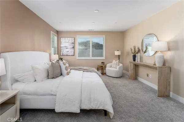 a bedroom with a bed and window