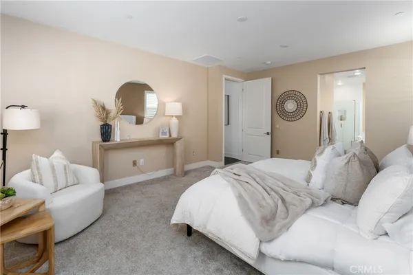 a bedroom with a bed and a lamp