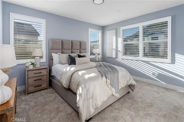 a bed room with a bed and a night stand