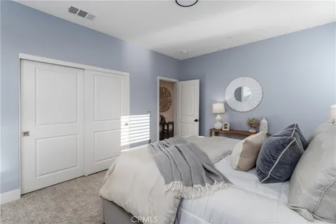 a bedroom with a bed and closet