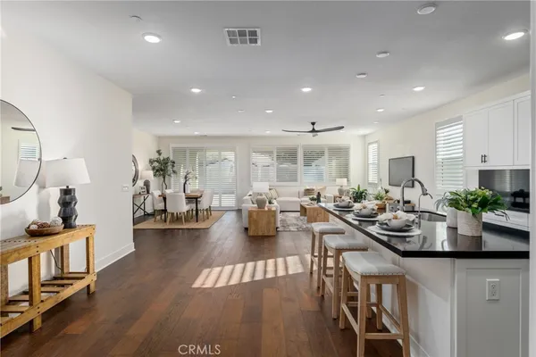 a very nice looking living room with furniture and a wooden floor