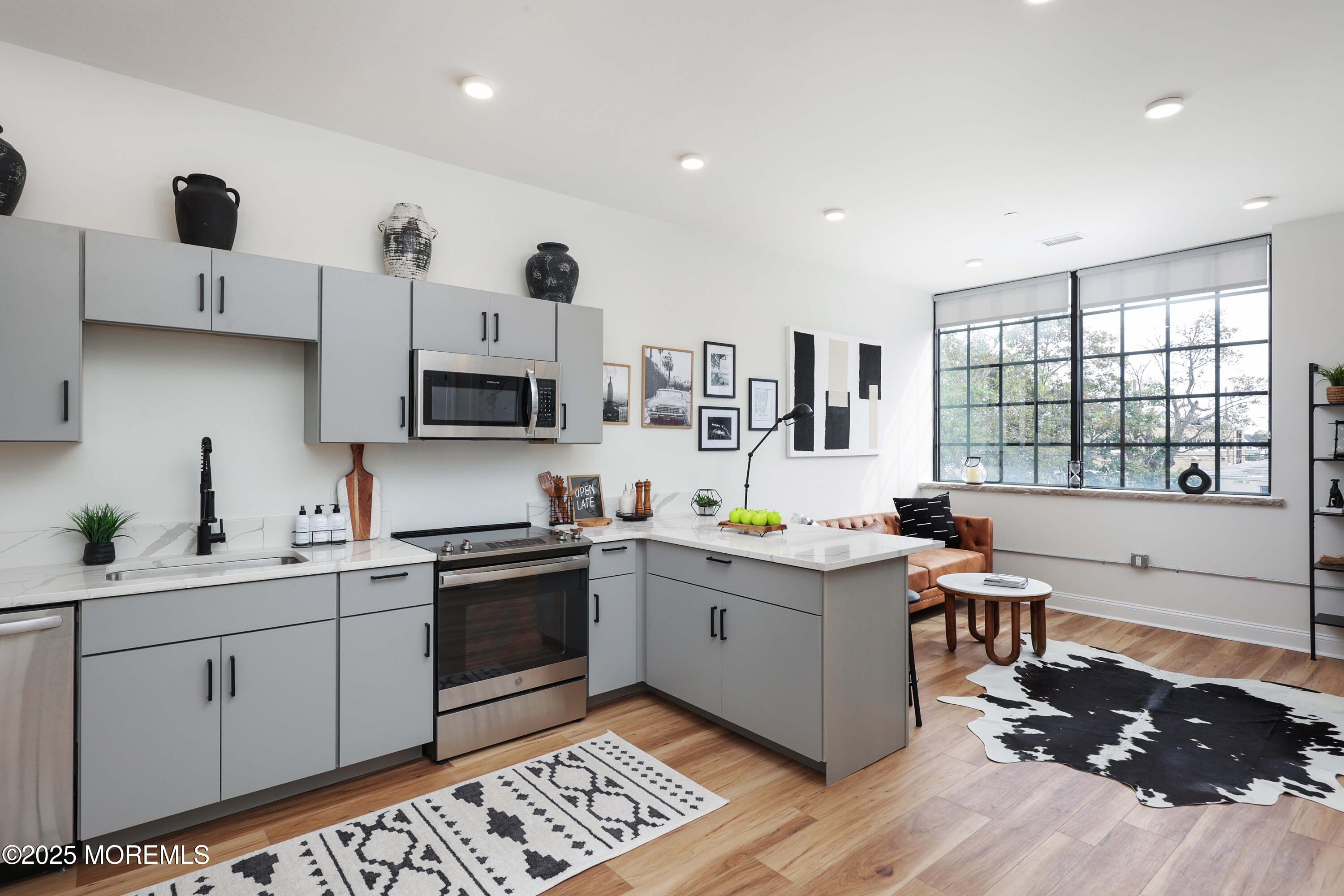 179 Chelsea Avenue, Unit 304 Long Branch, NJ 07740 - Photo 3 of 13 a kitchen with a sink cabinets and window