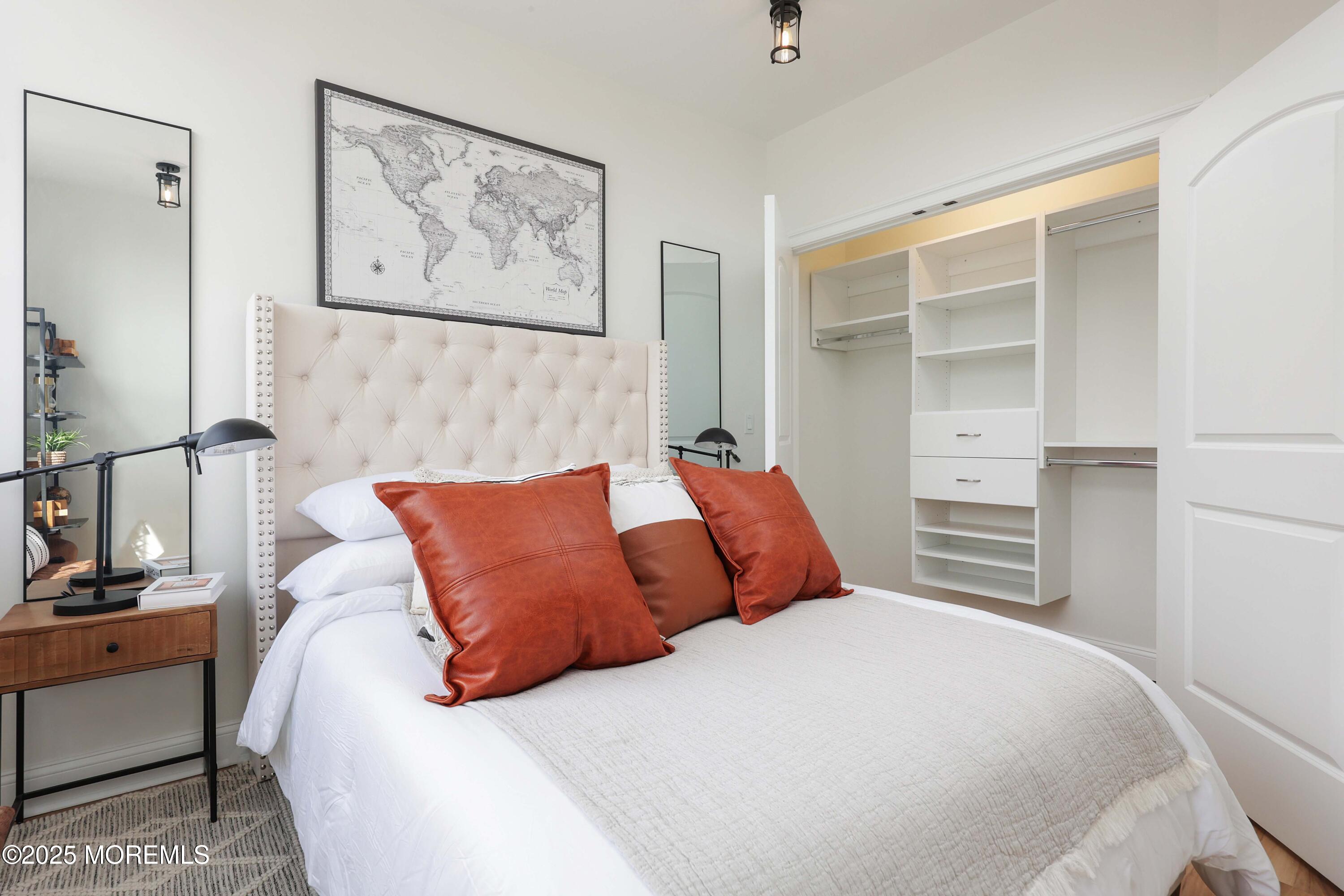 179 Chelsea Avenue, Unit 304 Long Branch, NJ 07740 - Photo 10 of 13 a bedroom with a bed and a view of bathroom