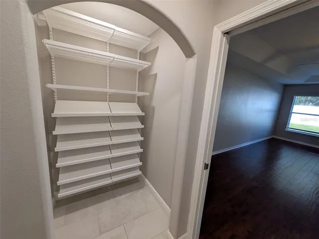 a view of a room with stairs and a window